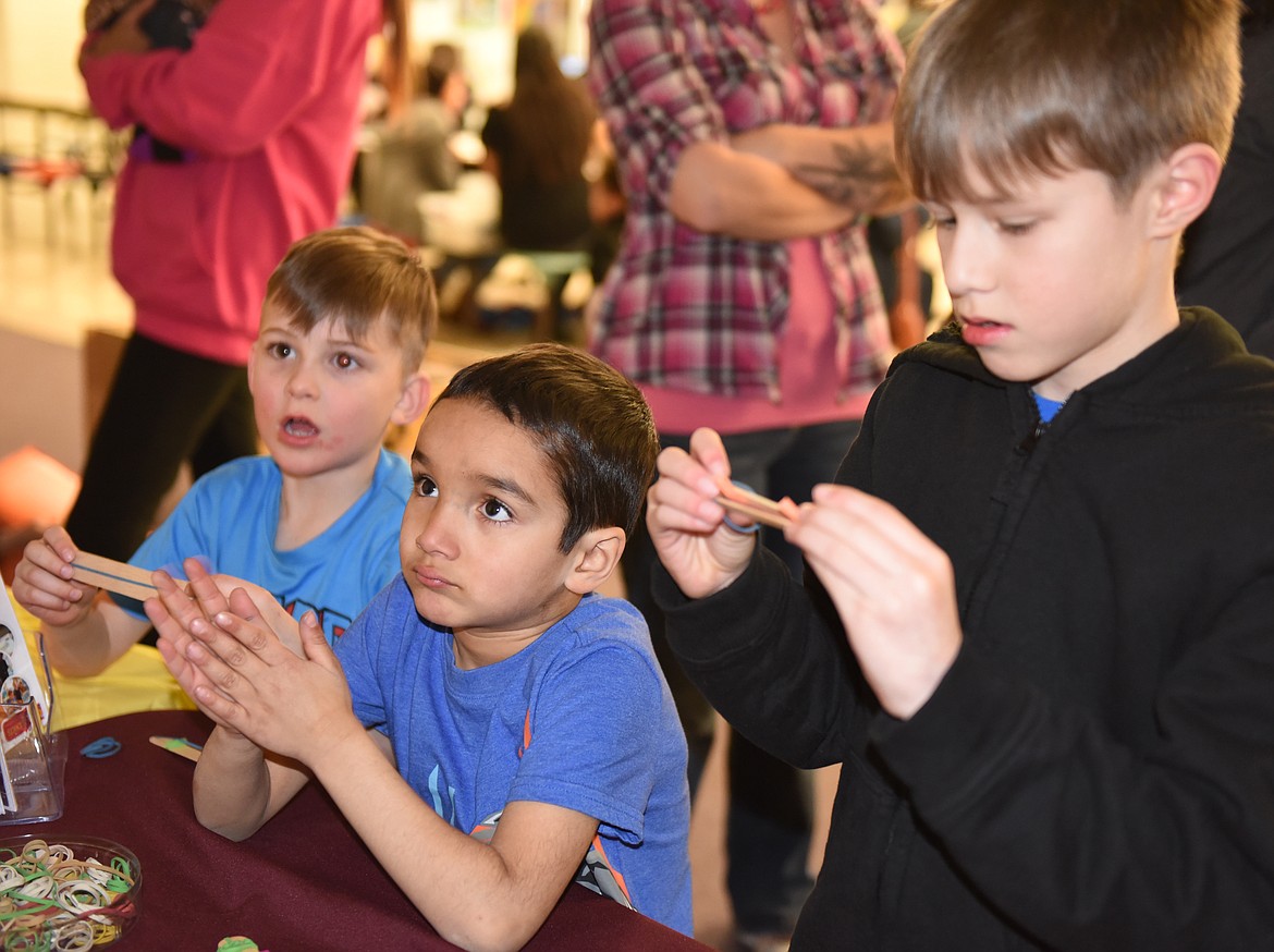 KAZOO CONSTRUCTION was a popular event during the STEAM event last Thursday at Polson High School. Pictured from left are Cherry Valley students Mason Combs and Myles Means, and Linderman Elementary student Caleb (no last name given).