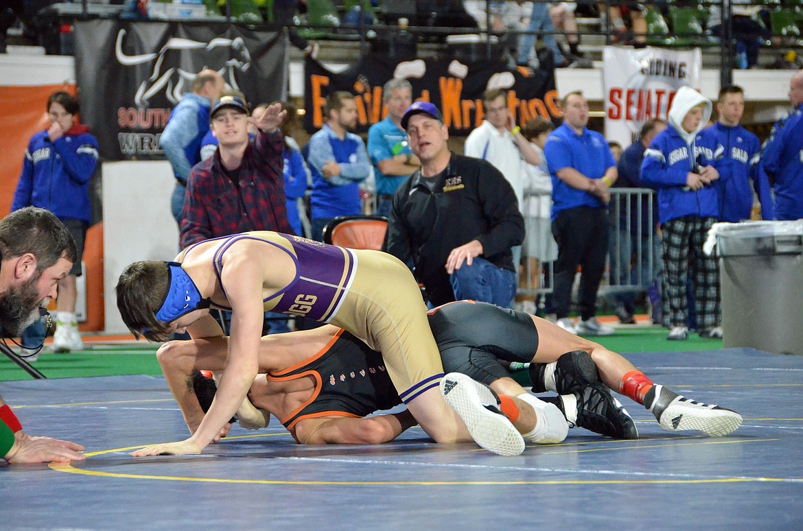 Dakota Eixenberger tries to roll his opponent over for a pin.