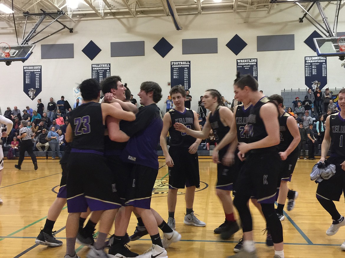 MARK NELKE/Hagadone News Network
Gavin Luna of Kellogg, who made the game-winning 4-point play with 1.1 seconds left, is mobbed by teammates after the Wildcats beat Timberlake 51-50 in the 3A District 1 boys championship game Thursday night in Spirit Lake.