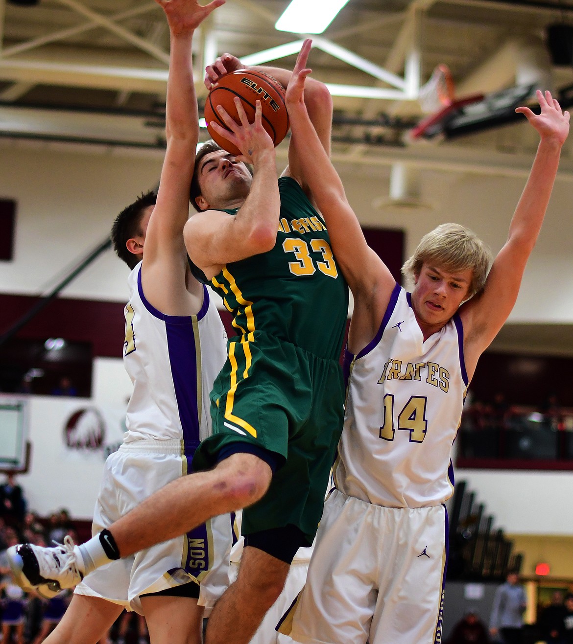 Ryan Kemm fights through contact during Friday&#146;s Western A Divisional win over Polson. (Jeremy Weber/Hungry Horse News)