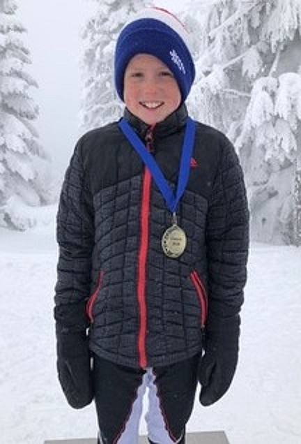 (Photo courtesy of VICKI LONGHINI)
Callahan Waters smiles with one of his first-place medals after the Mt. Spokane Junior National Qualifiers on Feb. 17. Waters was first in his U12 age group on the classic and skate day.