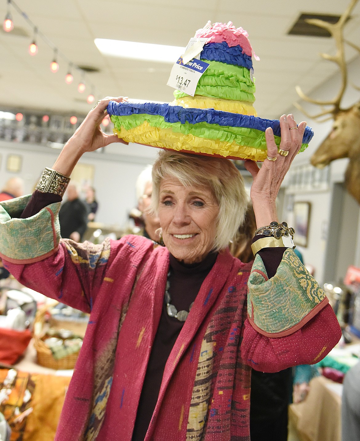 ARLENE EKLAND-EARNST tries on a sombrero that was a silent auction item during the Winter Fiesta benefit last Saturday night at the Polson Elks Lodge. Turns out the hat doesn&#146;t have a hole for your head, so it serves a decorative function.