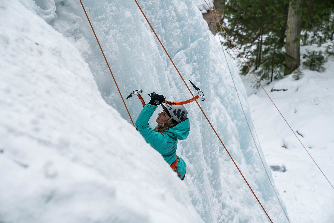 A woman climbs ice during a Whitefish Vertical Adventures guided trip. (Tyler Brower photo)
