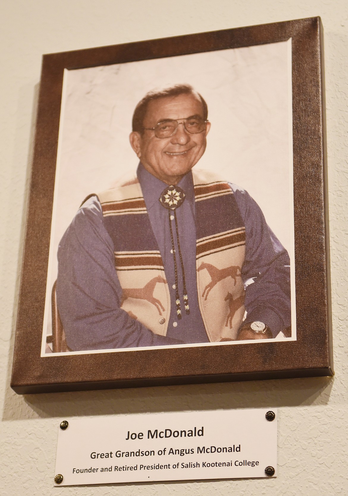 THIS PHOTO of Salish Kootenai College founder and retired president Joe McDonald hangs in the Ninepipes Museum of Early Montana. (File Photo)