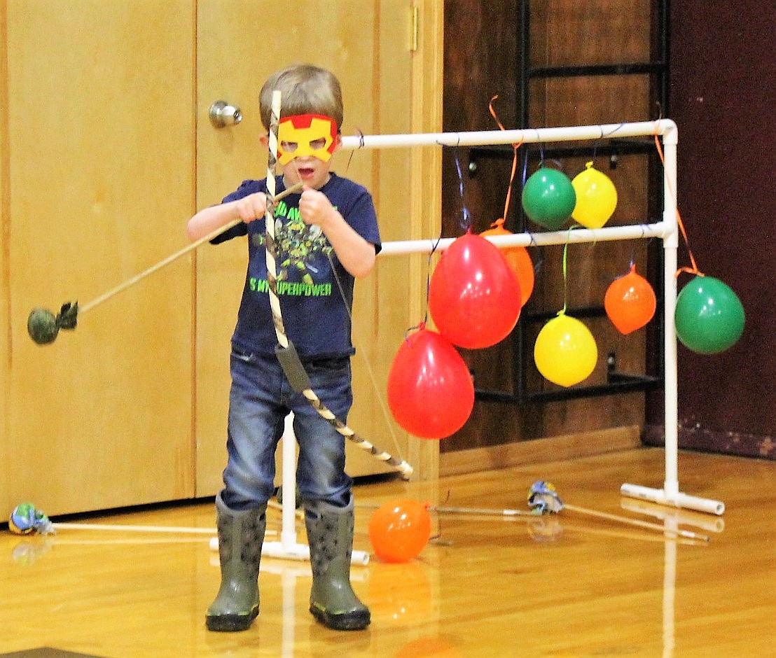 Super Hero Bowen Warren tries his luck with a bow and arrow at the children&#146;s party in Alberton last Saturday.

 
(Kathleen Woodford/Mineral Independent).