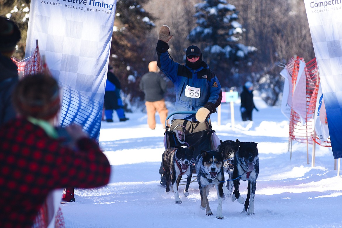 Steve Riggs finishes the four-dog race during the Flathead Classic Sled Dog Race held at Dog Creek Lodge last weekend. (Daniel McKay/Whitefish Pilot)