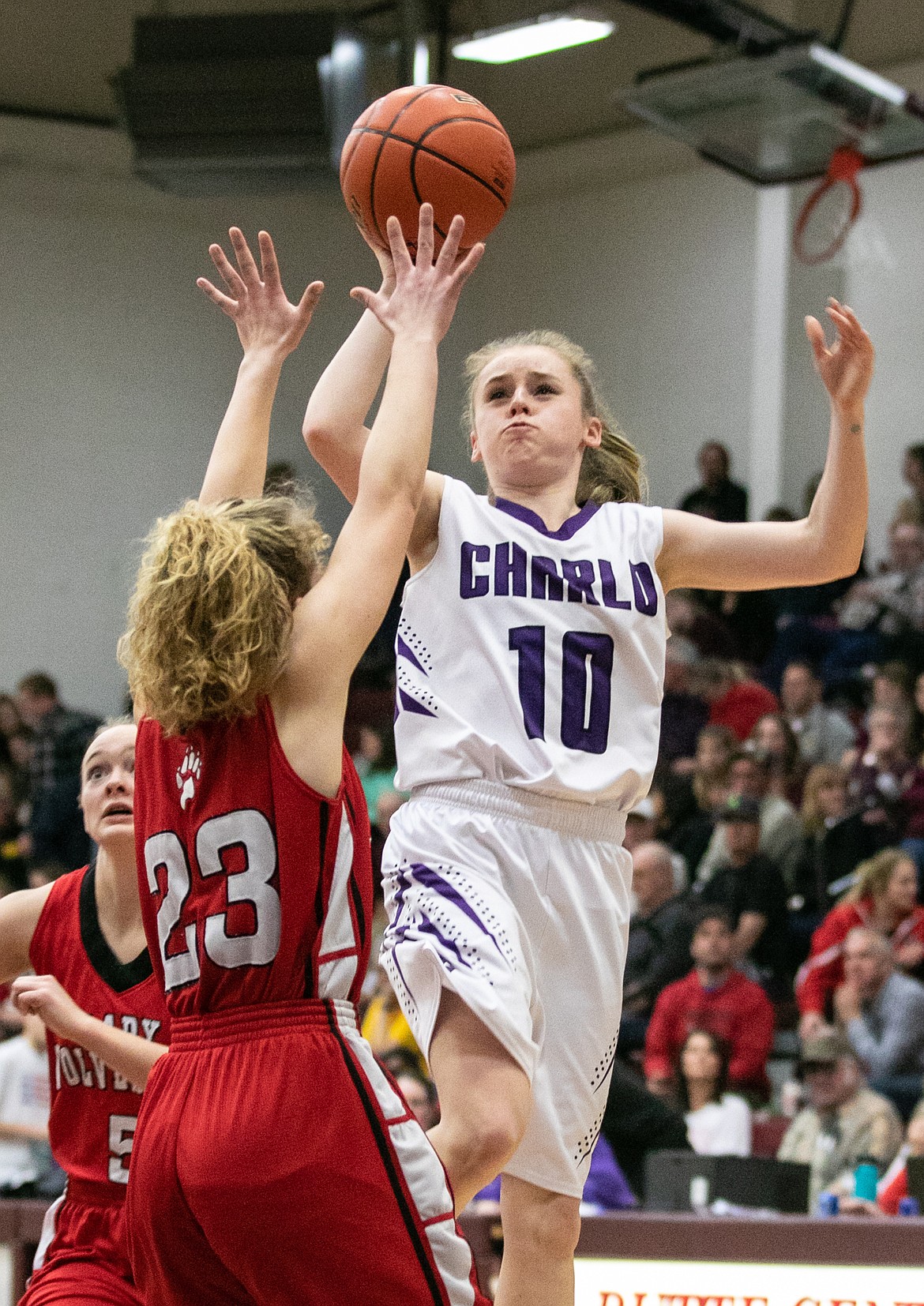 Charlo&#146;s Kaitlin Cox shoots over a West Yellowstone defender in the semifinal game at the Western C Divisional tournament in Butte. The Lady Vikings won and moved on to face Arlee in the championship game. (Photo courtesy of Kylie Richter)