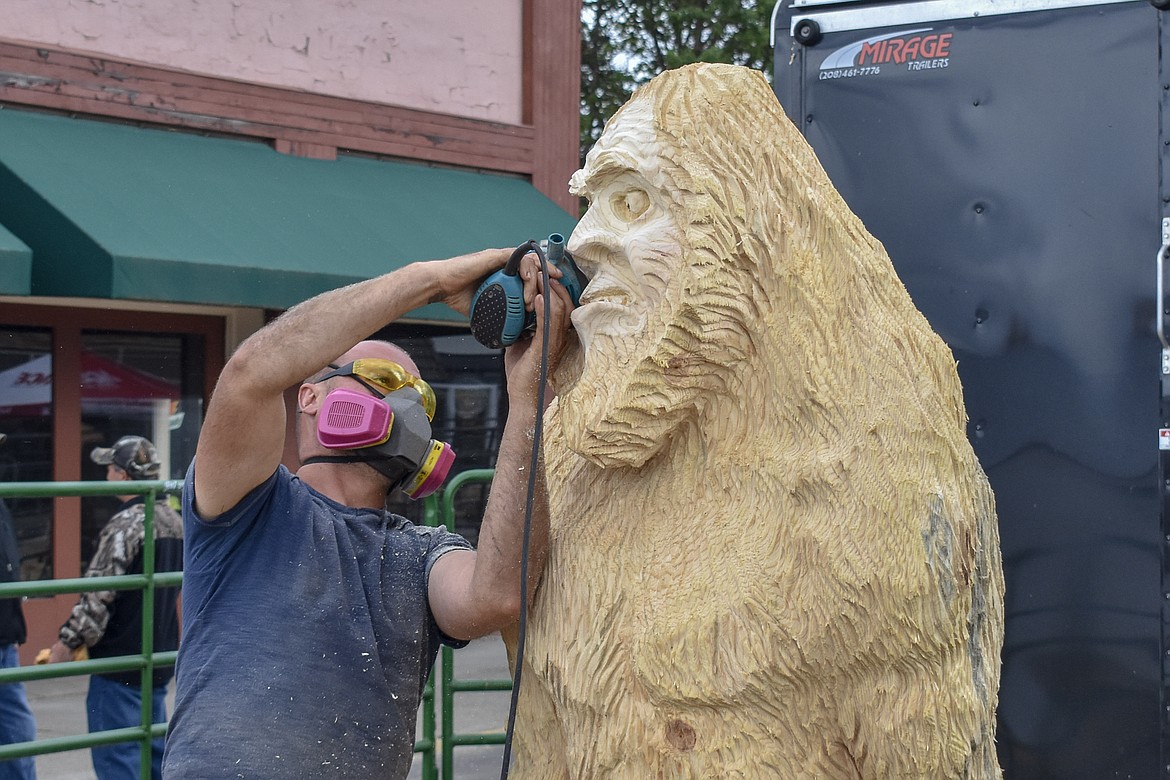 Alex Pricob -- originally from Moldova and currently living in Seattle -- works on his piece during the Kootenai Country Montana Chainsaw Carving Championship on Sept. 23, 2018. (Ben Kibbey/The Western News)