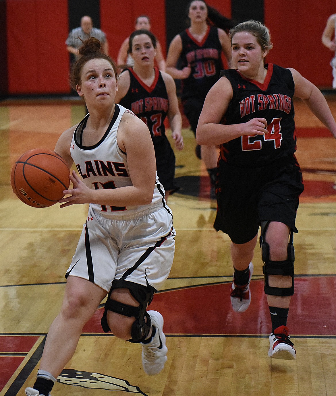 KASSIDY KINZIE of Plains heads for the hoop during the Trotters' 14C District Tournament game against Hot Springs. (Joe Sova/Clark Fork Valley Press)