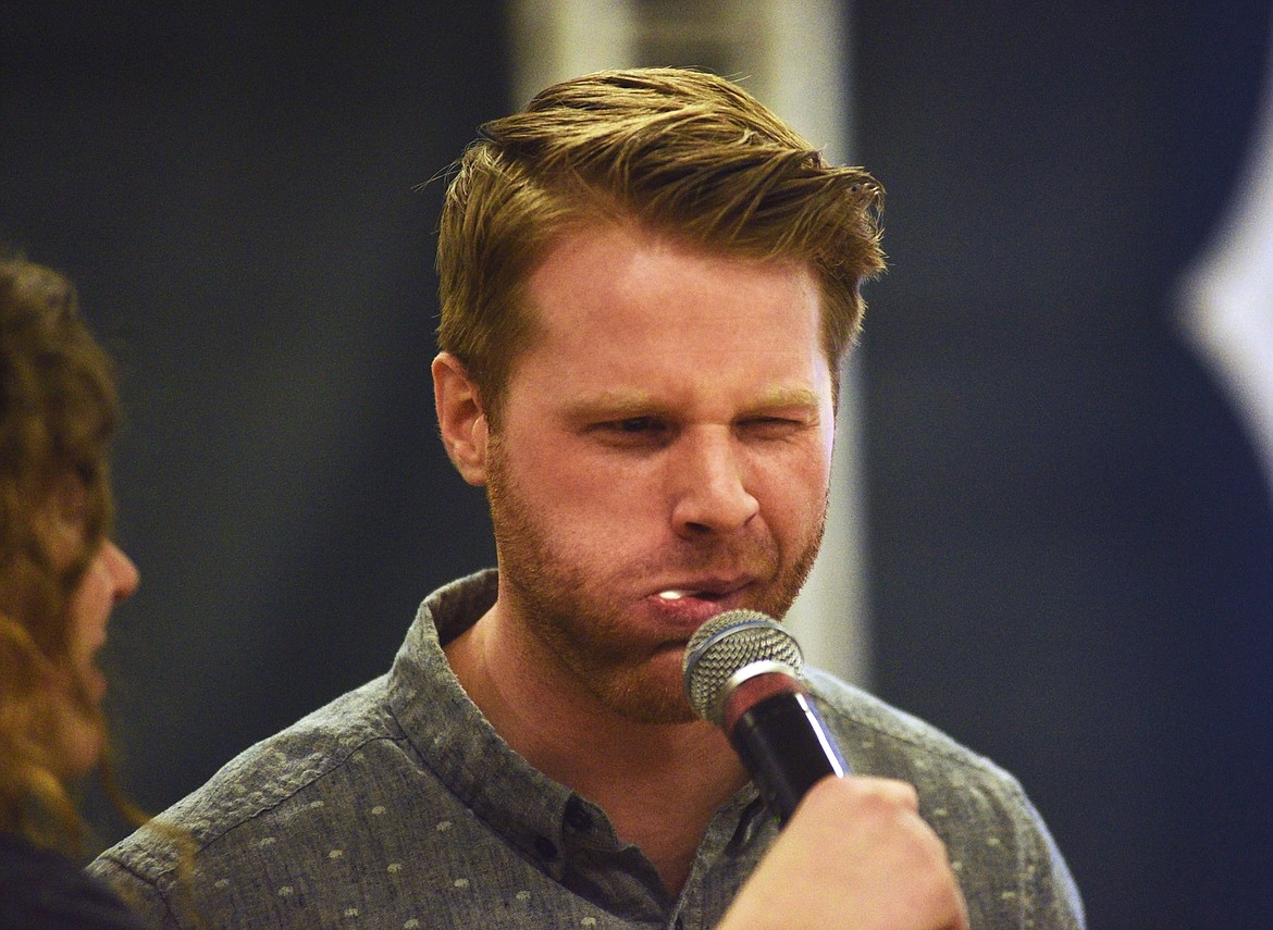 Business Teacher Willie Roche, with a mouth full of ketchup-covered marshmallows, competes in a game during iThinkBig's assembly last Wednesday at Whitefish High School. (Daniel McKay/Whitefish Pilot)