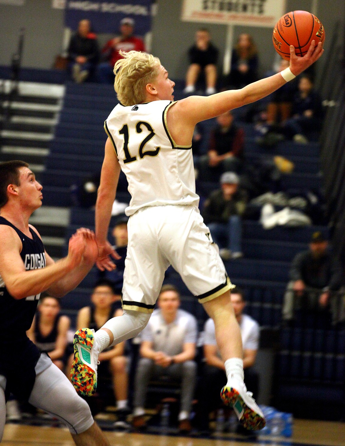 Rodney Harwood/Sun TribuneRoyal point guard Gage Christensen soars to the basket on a break away during the second quarter of the Knights 1A regional play-in game with Cascade Christian.