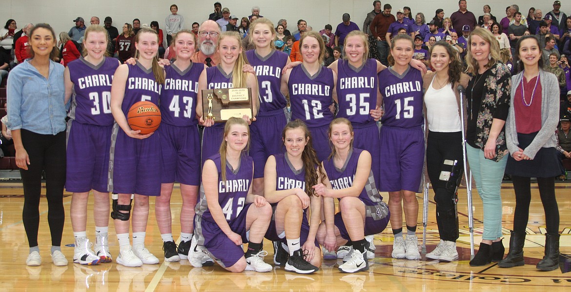 CHARLO'S GIRLS'  team is pictured with their first-place trophy after winning the championship game in the 14C District Tournament last Saturday evening in Pablo. (Photo courtesy of Sheri Delaney)