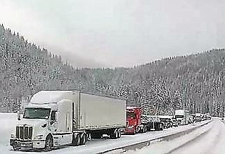 SEMIS AND other vehicles in the westbound lanes of I-90 were backed up for miles last Wednesday, Feb. 13 due to an avalanche that came roaring down from the mountain. The lanes were reopened about 6 p.m. last Thursday, but drivers are asked to use extreme caution.