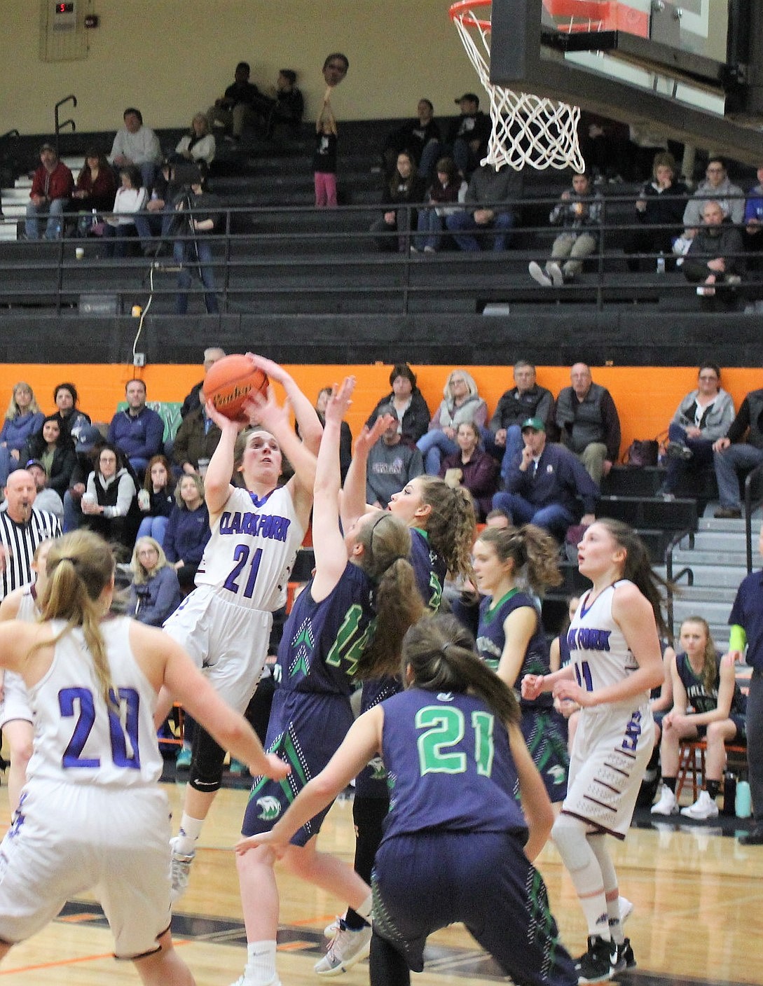 MADISON MASK of the Clark Fork Mountain Cats drives home a layup against Valley Christian in their consolation game at the 13C District Tournament on Saturday in Frenchtown. The Cats placed third. (Kathleen Woodford/Mineral Independent)