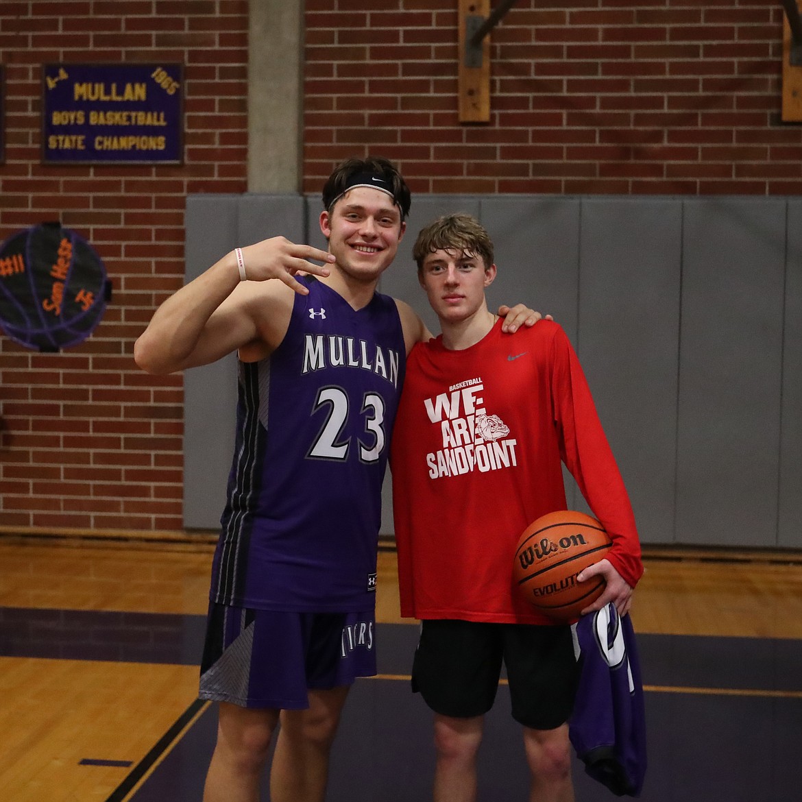 (Photo by KYLE CAJERO) Sandpoint seniors Alex Stockton and Bruin Jones pose together after the District 1 All-Star game at Mullan High School.