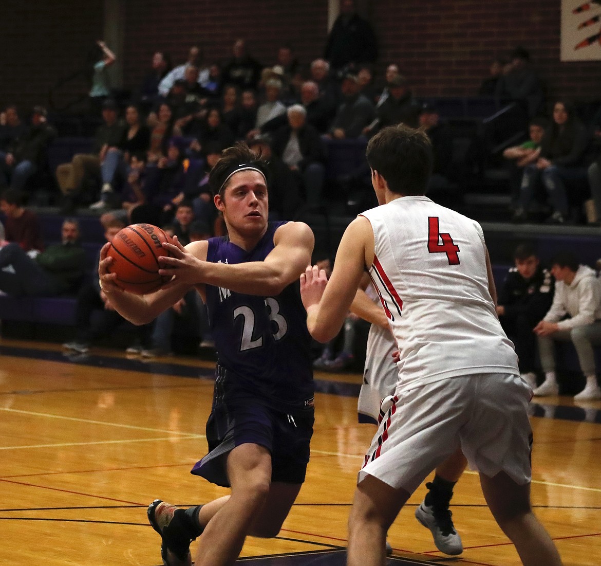 (Photo by KYLE CAJERO)
Alex Stockton eurosteps past Wallace senior Erick Brackebusch during the District 1 All-Star game.