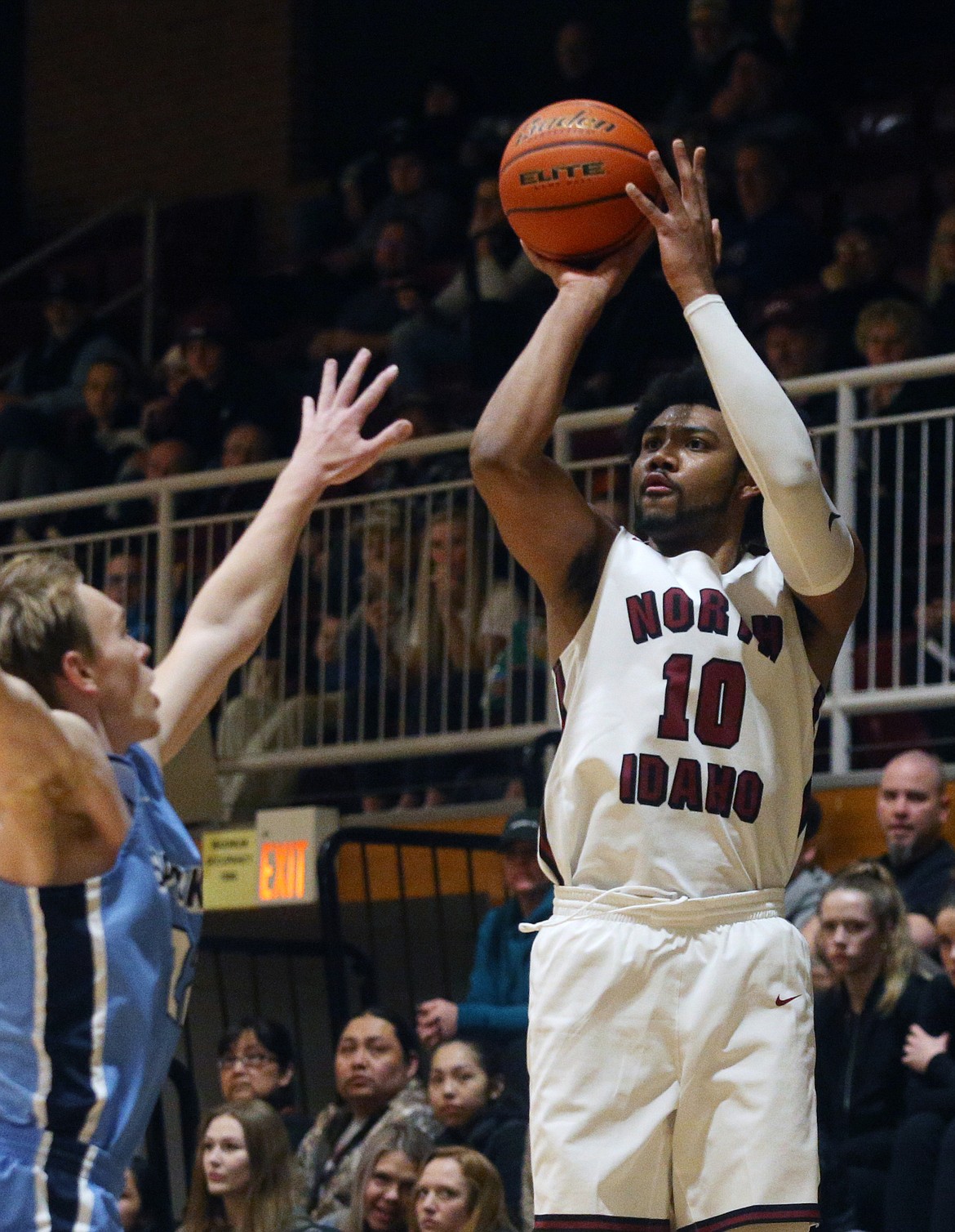 LOREN BENOIT/Press
North Idaho College&#146;s Alphonso Anderson shoots a three over Garrett White of Community Colleges of Spokane at Rolly Williams Court on Feb. 20.