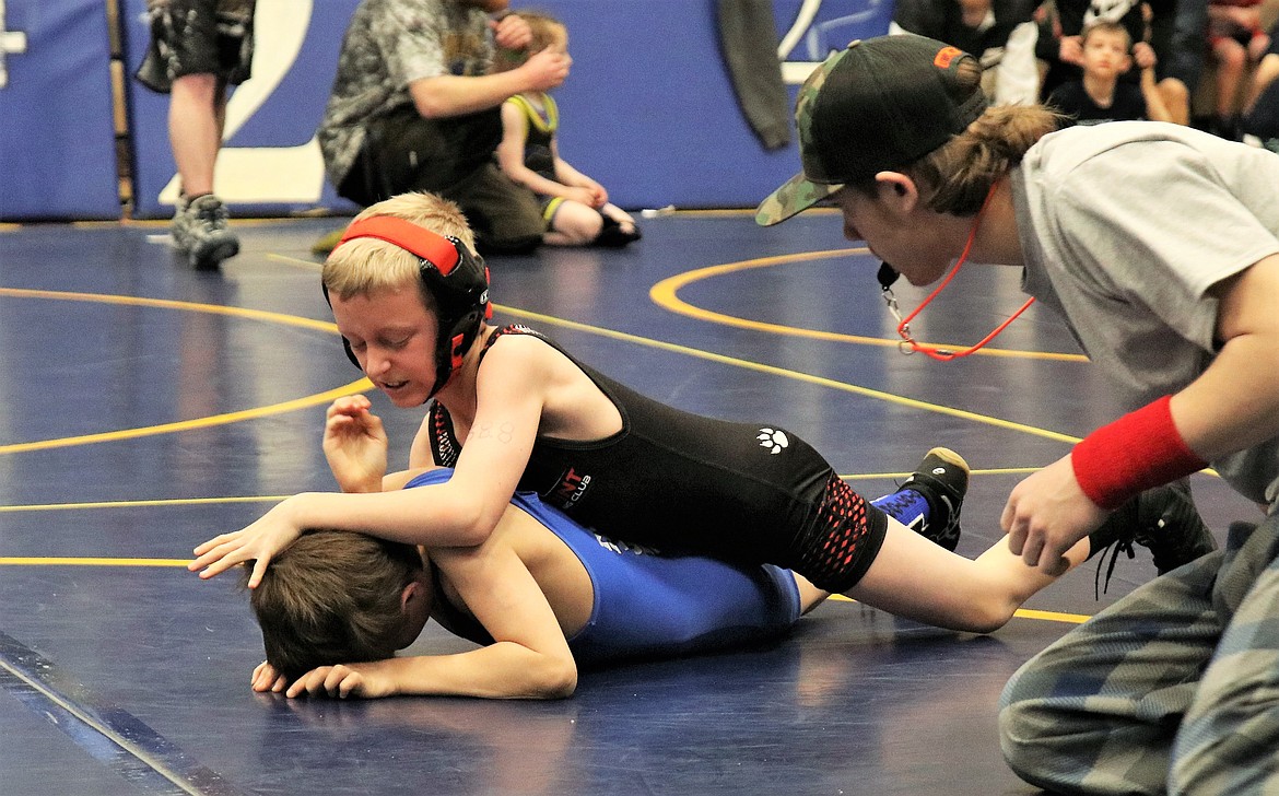 (Photo courtesy of TAMI WOOD)
Tyler Wood prepares to put a half nelson on his opponent at the Kootenai Klassic on Mar. 2.