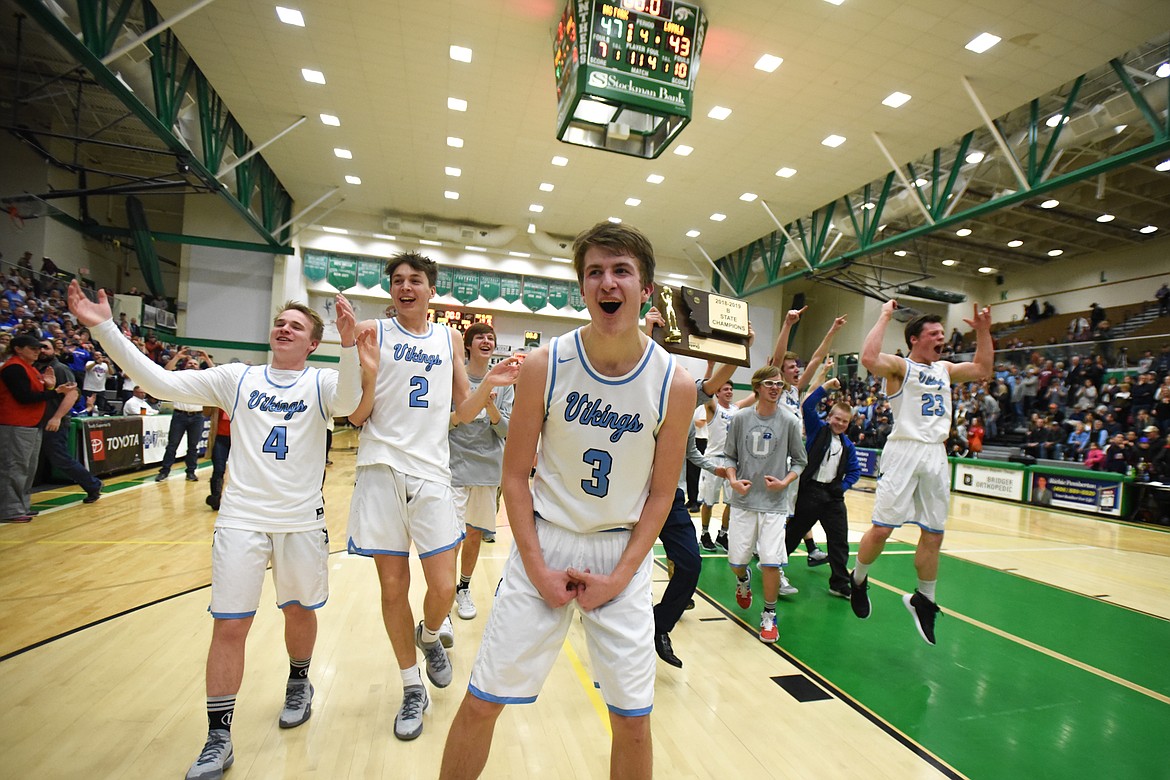 Bigfork celebrates its 47-43 victory over Loyola Sacred Heart in the State Class B boys' basketball championship at the Belgrade Special Events Center in Belgrade on Friday. (Casey Kreider/Daily Inter Lake)