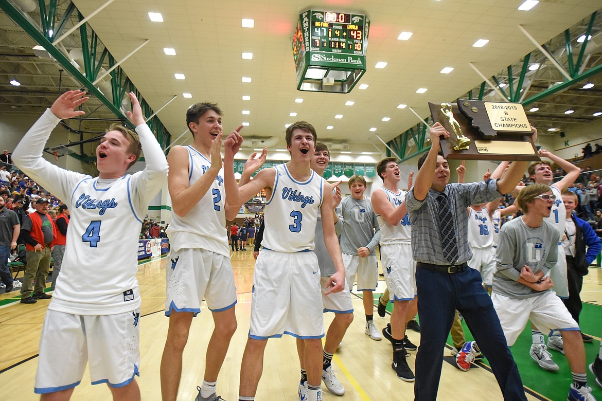 Bigfork celebrates its 47-43 victory over Loyola Sacred Heart in the State Class B boys' basketball championship at the Belgrade Special Events Center in Belgrade on Friday. (Casey Kreider/Daily Inter Lake)
