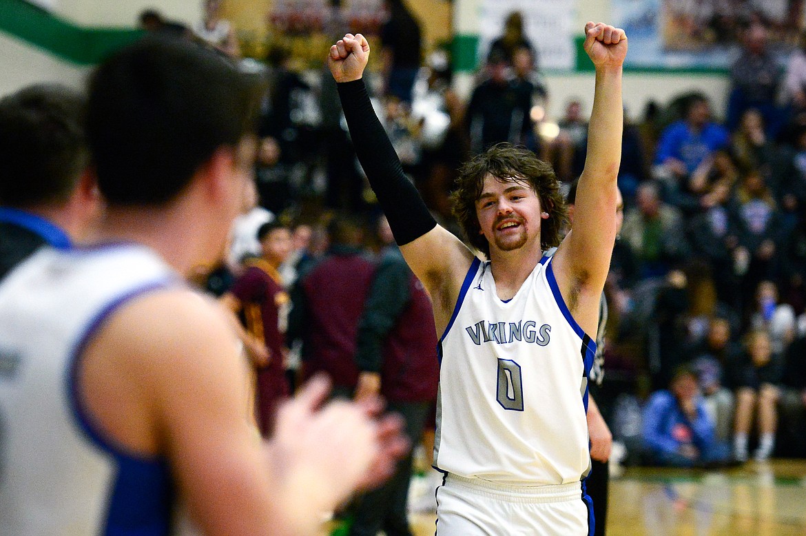 Bigfork's Anders Epperly (0) celebrates after a 75-60 win over Poplar in the State Class B Boys' Basketball Tournament at the Belgrade Special Events Center in Belgrade on Thursday. (Casey Kreider/Daily Inter Lake)