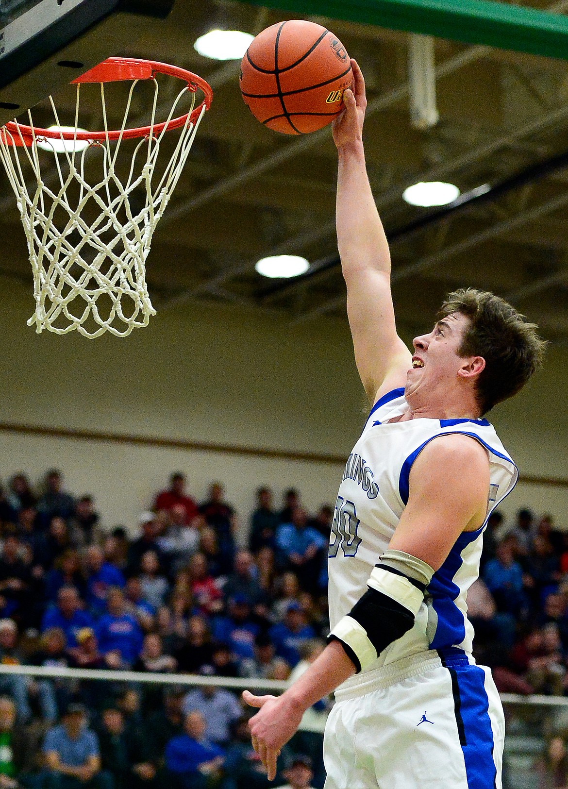 Bigfork's Logan Gilliard (30) reaches but can't get a dunk to drop through the hoop against Poplar in the State Class B Boys' Basketball Tournament at the Belgrade Special Events Center in Belgrade on Thursday. (Casey Kreider/Daily Inter Lake)