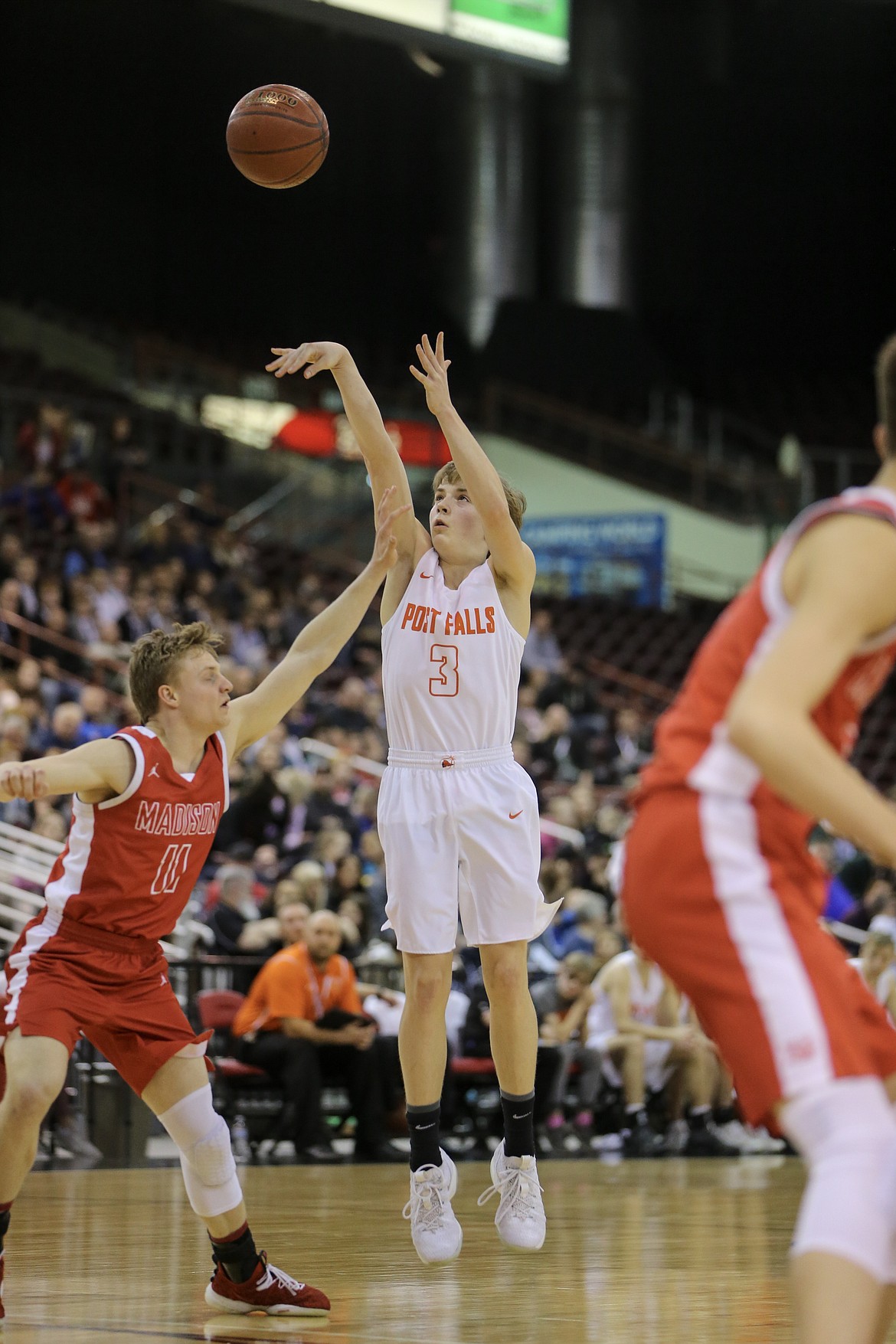 Caden McLean shoots a 3 point shot vs Madison in the second round of the 5A Boys State Tournament