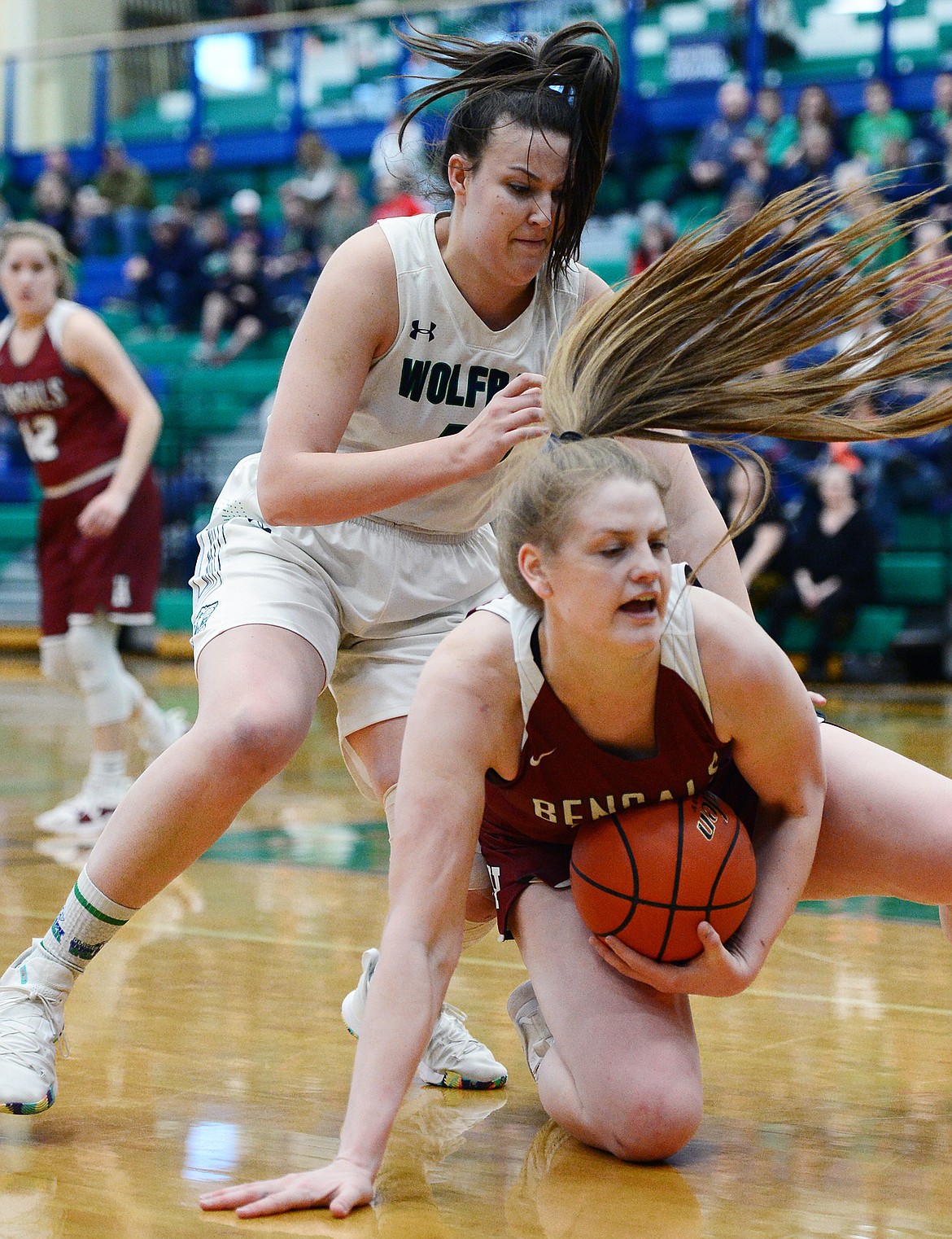 Glacier's Raley Shirey (40) and Helena High's Jamie Pickens (42) battle for a loose ball during Western AA Divisional play at Glacier High School on Saturday. (Casey Kreider/Daily Inter Lake)