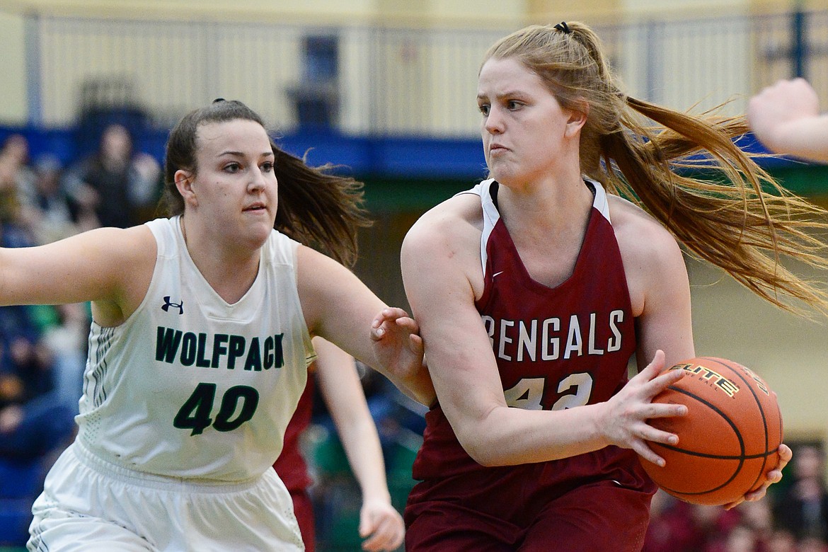 Helena High's Jamie Pickens (42) looks to pass with Glacier's Raley Shirey (40) defending during Western AA Divisional play at Glacier High School on Saturday. (Casey Kreider/Daily Inter Lake)