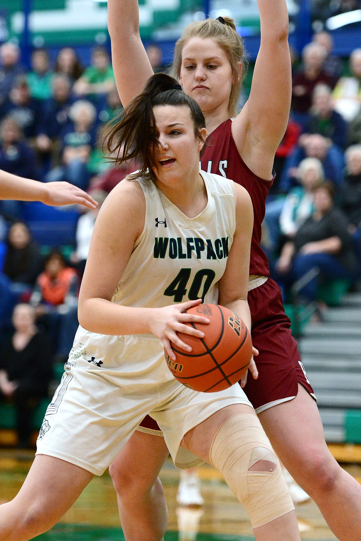 Glacier's Raley Shirey (40) works in the post against Helena High's Jamie PIckens (42) during Western AA Divisional play at Glacier High School on Saturday. (Casey Kreider/Daily Inter Lake)