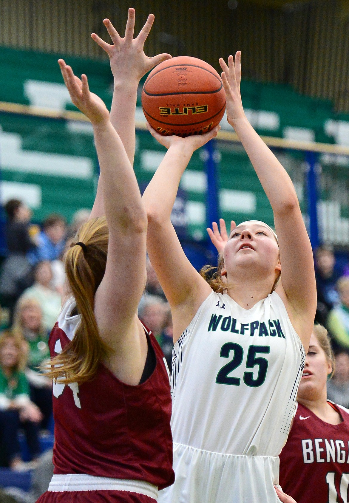 Glacier's Emma Anderson (25) shoots over Helena High's Jamie Pickens (42) during Western AA Divisional play at Glacier High School on Saturday. (Casey Kreider/Daily Inter Lake)