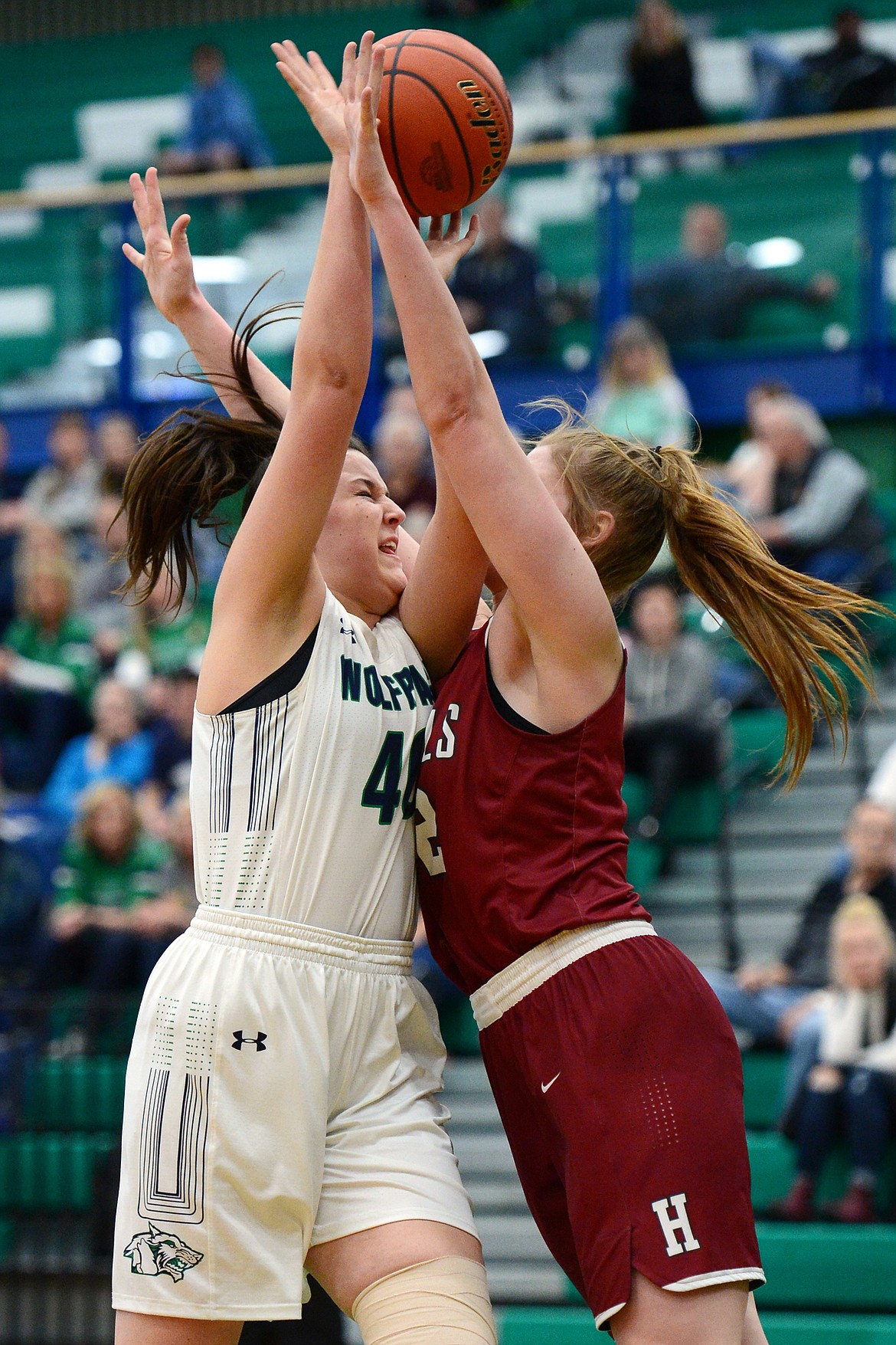 Glacier's Raley Shirey (40) goes up for a shot with Helena High's Jamie Pickens defending during Western AA Divisional play at Glacier High School on Saturday. (Casey Kreider/Daily Inter Lake)