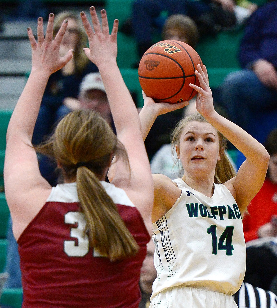 Glacier's Aubrie Rademacher (14) looks to shoot with Helena High's Caroline Bullock (34) defending during Western AA Divisional play at Glacier High School on Saturday. (Casey Kreider/Daily Inter Lake)