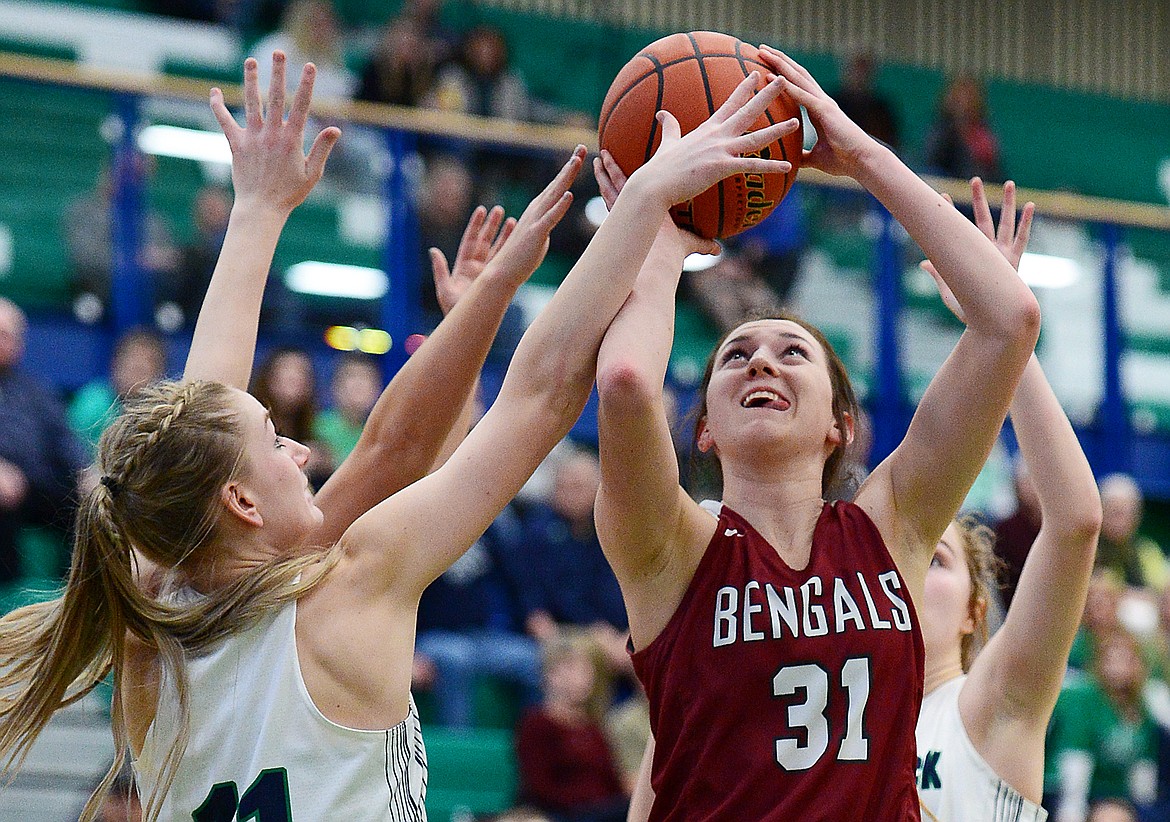 Helena High's Abby Marcille (31) looks to shoot with Glacier's Kaileigh Crawford (11) defending during Western AA Divisional play at Glacier High School on Saturday. (Casey Kreider/Daily Inter Lake)