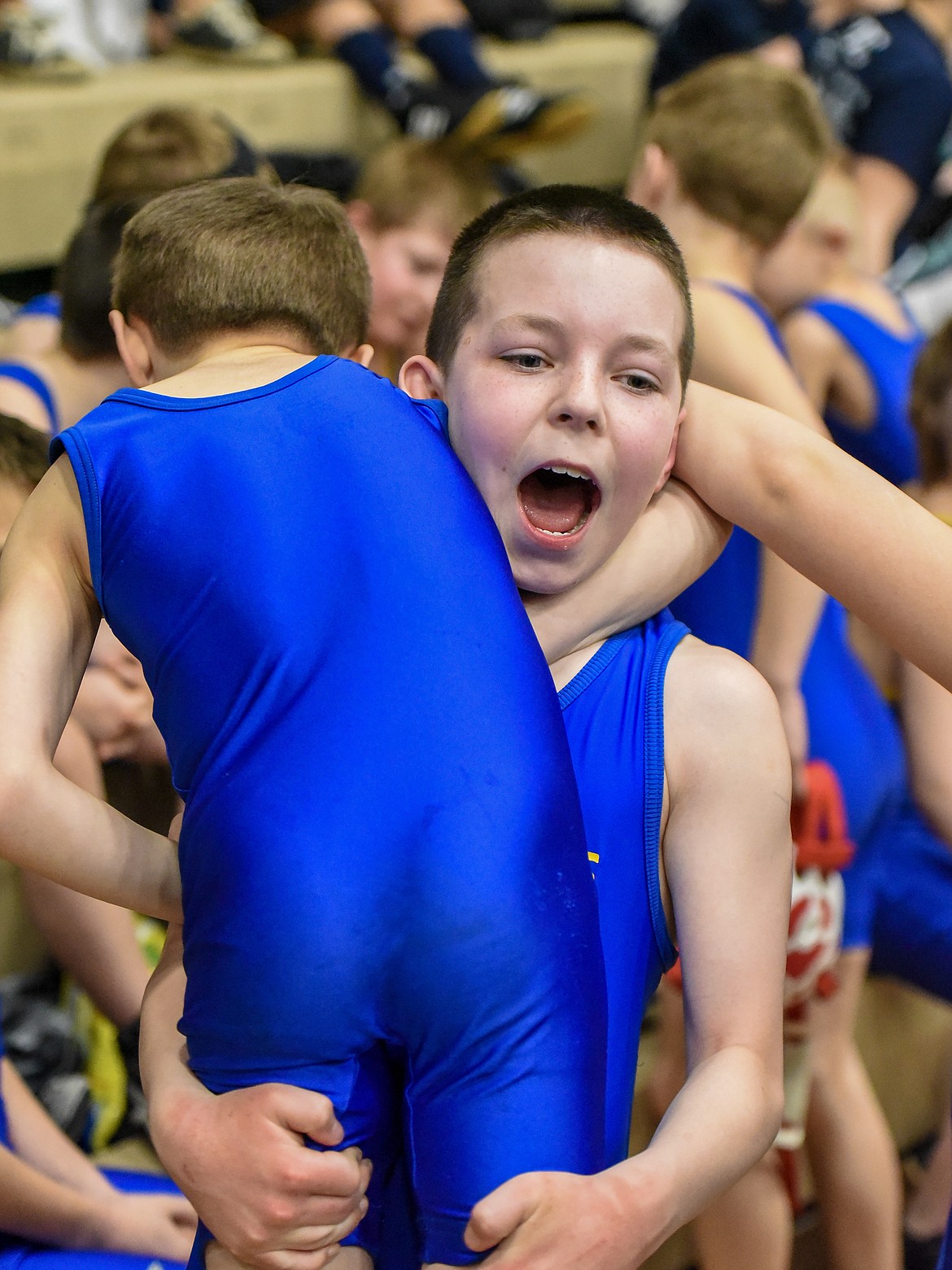 Hunter Rooney of Libby lifts another Greenchain wrestler in an energetic moment between matches at the Kootenai Klassic Wrestling Tournament Saturday. (Ben Kibbey/The Western News)