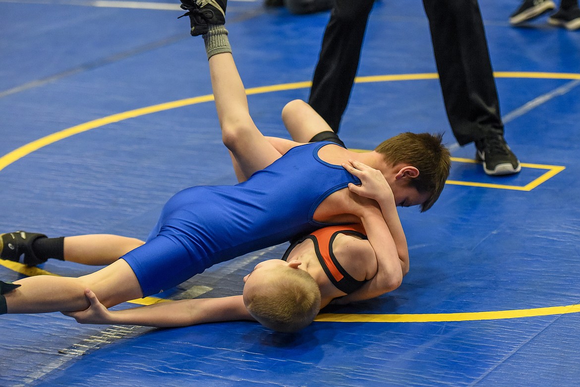 Blake Hoffman of Libby tries to get a pin against Fisher Miles of Eureka at the Kootenai Klassic Wrestling Tournament Saturday. (Ben Kibbey/The Western News)