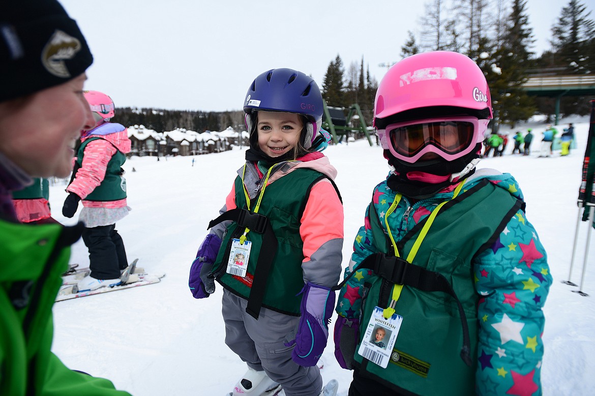 Instructor Lauren Page talks to a pair of young skiers before the start of the Buckaroo Ski Program at Whitefish Mountain Resort on Wednesday, Feb. 27. (Casey Kreider/Daily Inter Lake)