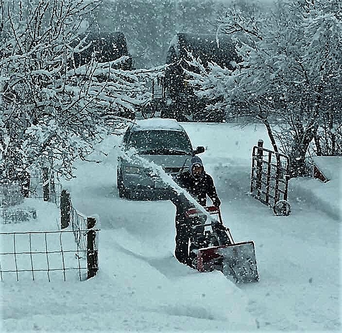 Tom Bean plows his driveway near Alberton last week as a series of storms dumped several feet of snow. (Photo courtesy of Ceciley Bean)