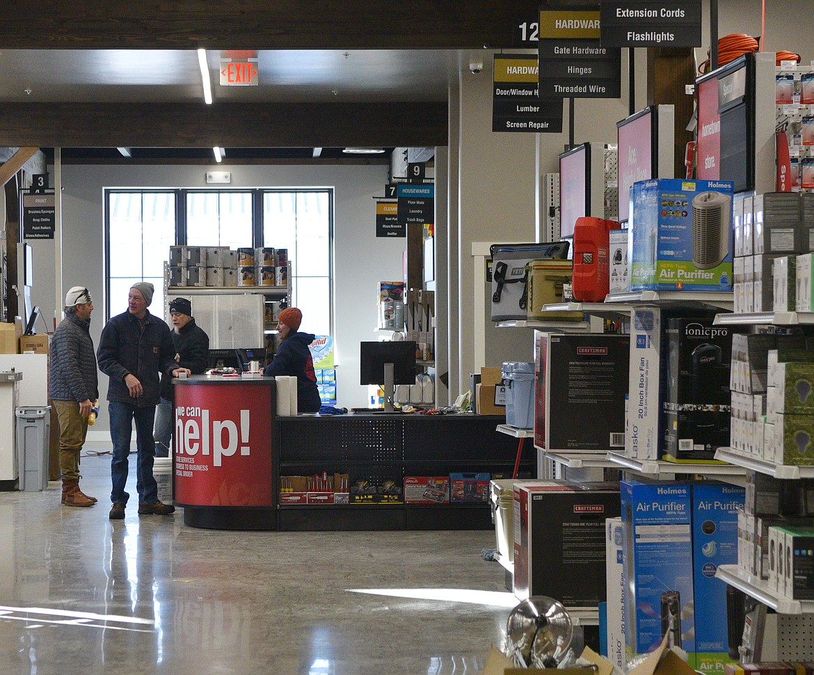 Customers shop in the new Nelson&#146;s Ace Hardware store Monday morning. The store relocated from Central Avenue to a new building on U.S. Highway 93. (Heidi Desch/Whitefish Pilot)