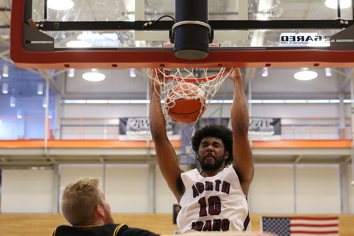 TRACY SWISHER/Northwest Athletic Conference
Alphonso Anderson of North Idaho College dunks for two of his 32 points in the Cardinals&#146; championship game win over Walla Walla on Sunday.