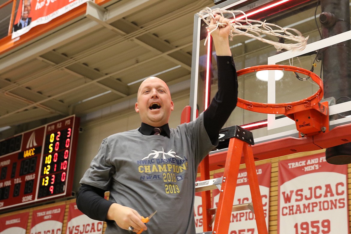 TRACY SWISHER/Northwest Athletic Conference
North Idaho College coach Corey Symons celebrates after the Cardinals won their second straight NWAC men&#146;s basketball tourney title Sunday in Everett, Wash.