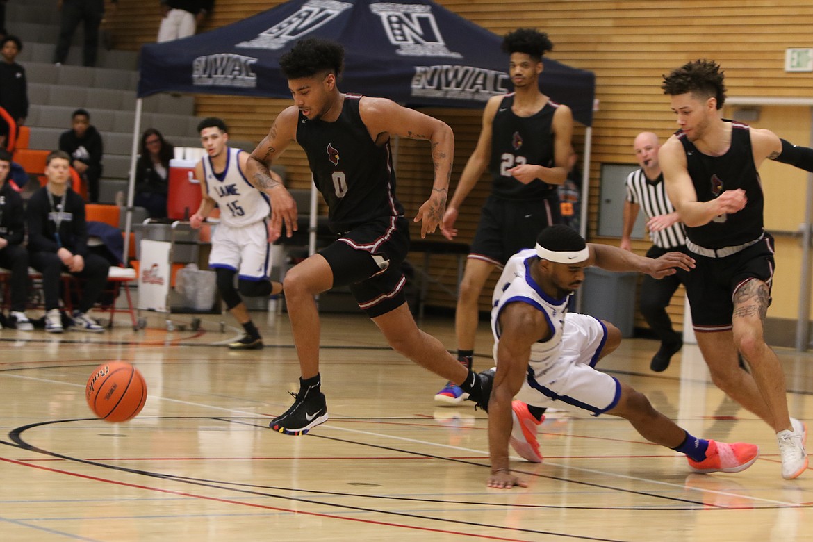 TRACY SWISHER/Northwest Athletic Conference
RayQuan Evans (0) of North Idaho College heads upcourt after a turnover vs. Lane on Saturday in Everett, Wash.