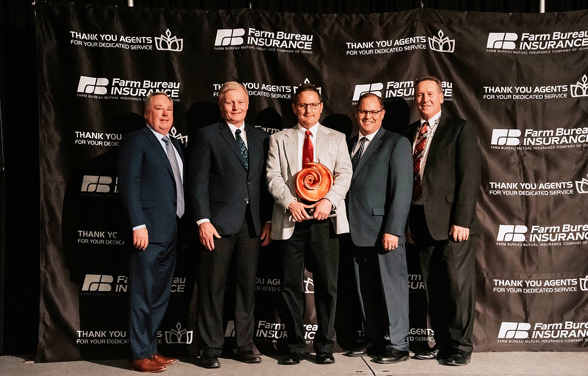 (Courtesy photo)
Farm Bureau Insurance recently presented its Agent of the Year award to Sandpoint agent Kendon Perry (center). Pictured with Kendon, left to right are: Chris Shryack, vice president of sales, Farm Bureau Financial Services; Paul Roberts, executive vice president and CEO, Farm Bureau Mutual Insurance Company of Idaho; Bryan Searle, president, Idaho Farm Bureau Federation; and Ron Leavitt, vice president of sales &amp; marketing, Farm Bureau Mutual Insurance Company of Idaho.