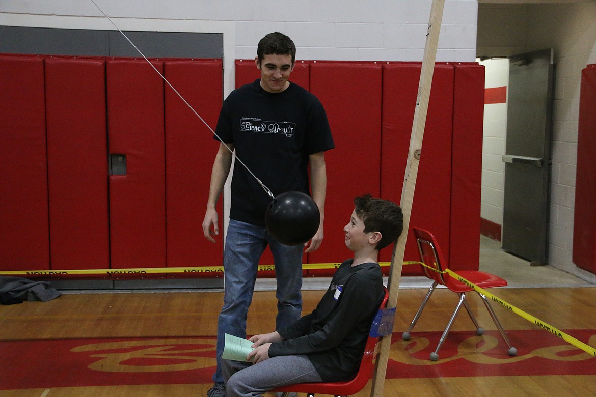 (Photo by MARY MALONE)
A group of Sandpoint High School students taught local fifth- and sixth-graders about the laws of conservation during the 6th annual SHS Science Circuit on Friday.