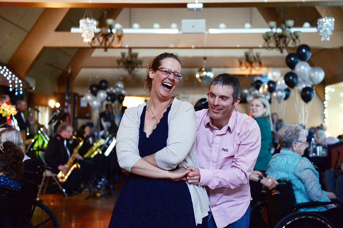 Christina Nelson and David Allison, son of resident Susan Allison, dance during the Senior's Ball at the Immanuel Skilled Care Center at Immanuel Lutheran Communities in Kalispell on Friday. (Casey Kreider/Daily Inter Lake)