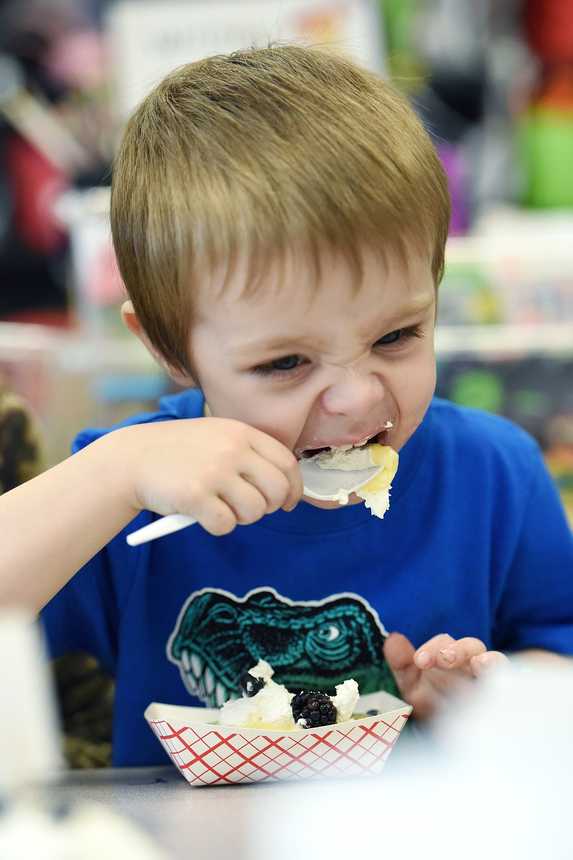 Bentley McCoy takes a bite from the pie he made while visiting his older sister&#146;s preschool classroom at Peterson Elementary to participate in Pi(e) Day activities. (Casey Kreider/Daily Inter Lake)