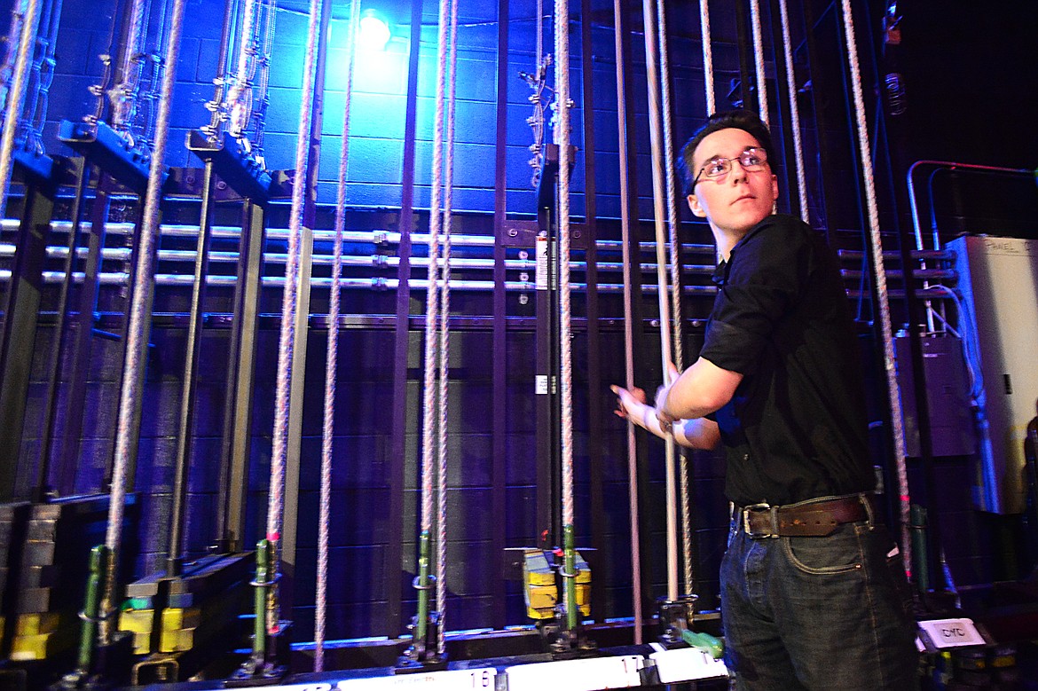 Skyler Staudenmayer, backstage chief, runs the fly lines which control movement of theatrical scenery during rehearsal for &#147;Addams Family: The Musical.&#148;