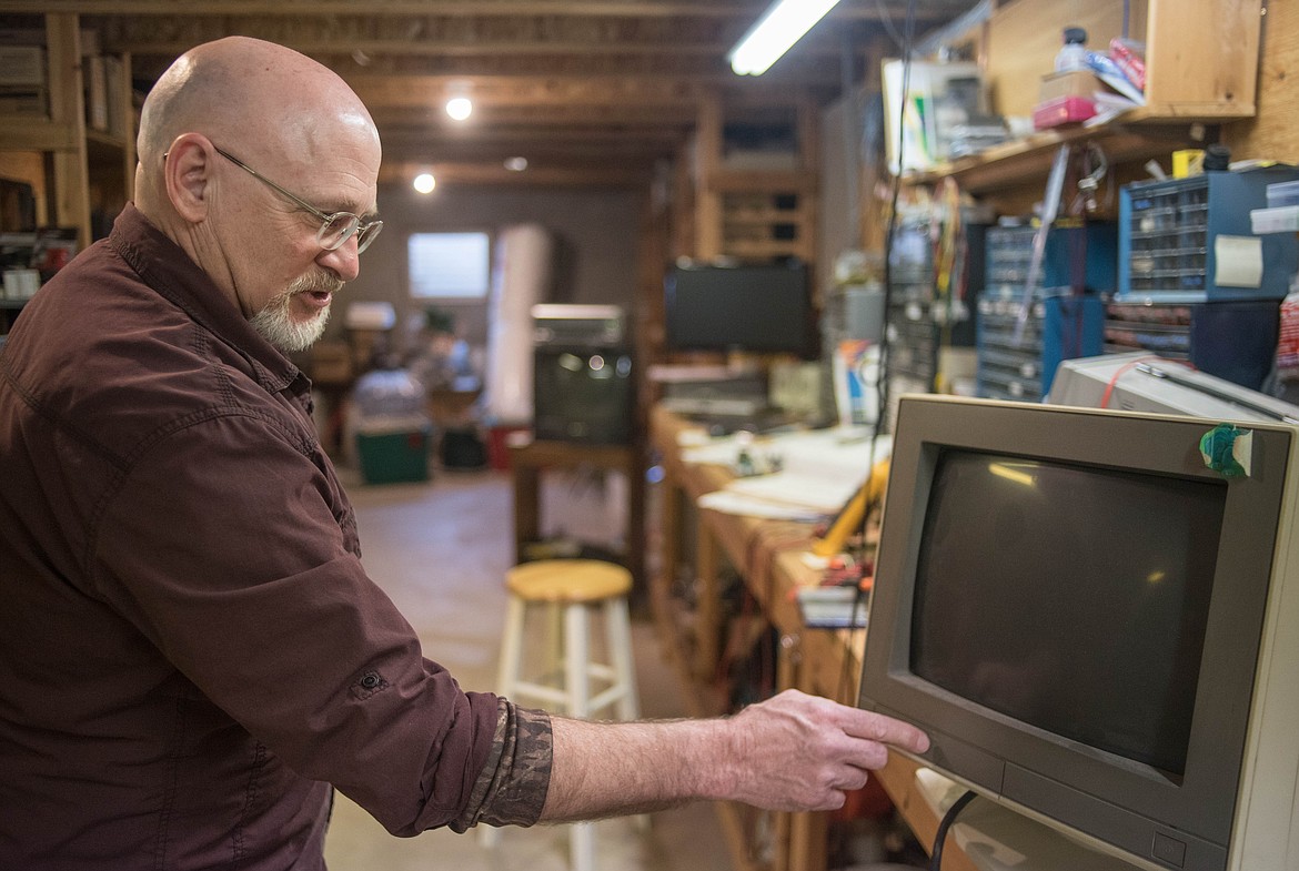 Bob Hosea, owner of CMH Software, shows off the computer he first used when he started creating electrical engineering programs, March 12 in Libby. &#147;That was high tech back in the day,&#148; said Hosea.