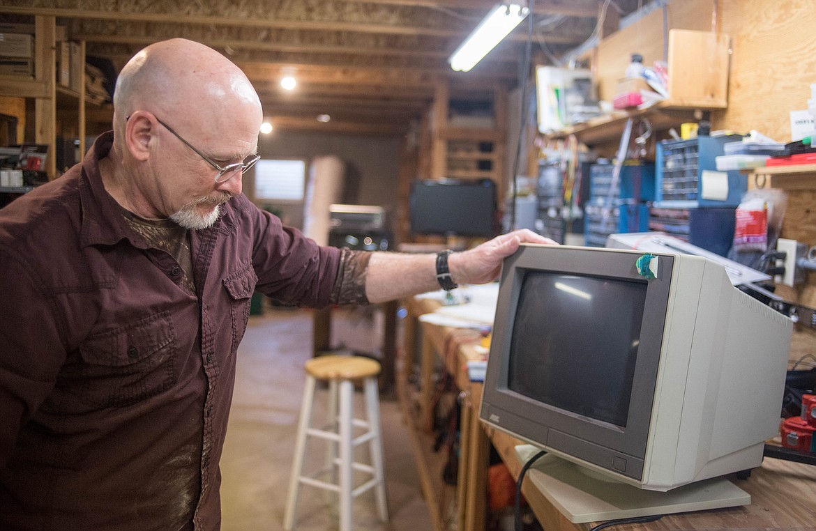 Bob Hosea, owner of CMH Software, shows off the computer he first used when he started creating electrical engineering programs, March 12 in Libby. &#147;That was high tech back in the day,&#148; said Hosea. (Luke Hollister/The Western News)