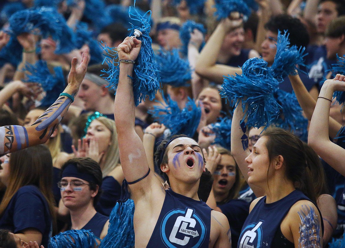 Lake City student Sawyer Halls cheers for the Timberwolves during a timeout during Fight for the Fish.